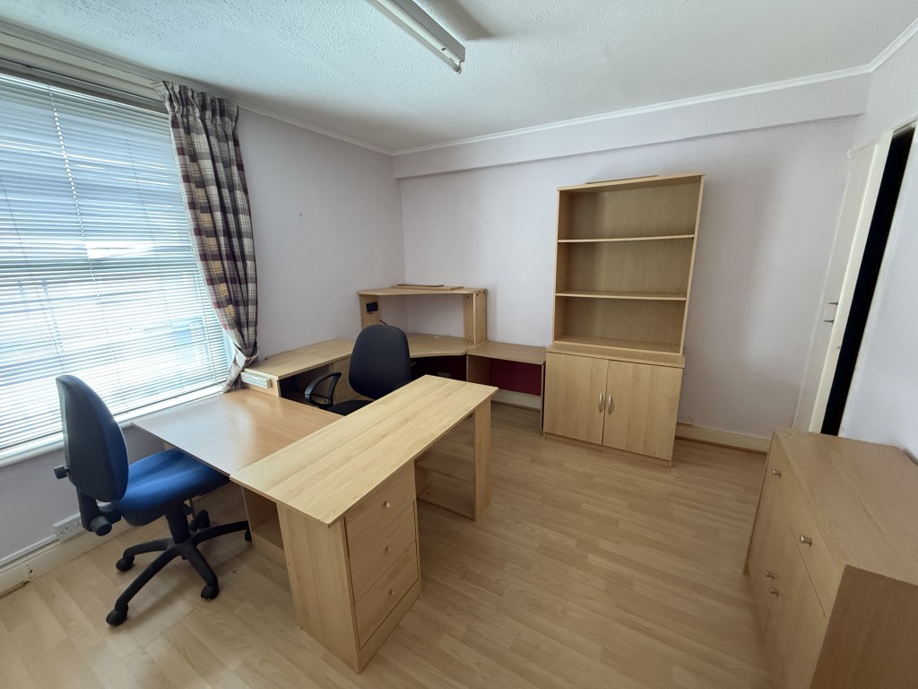 Lot: 142 - FREEHOLD TWO-BEDROOM HOUSE IN NEED OF IMPROVEMENT - Bedroom with laminate flooring